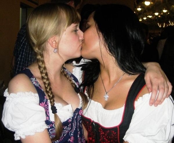 Oktoberfest girls kissing, Munich, Bavaria, Germany