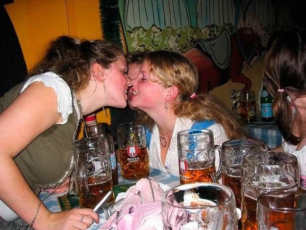 Oktoberfest girls kissing, Munich, Bavaria, Germany