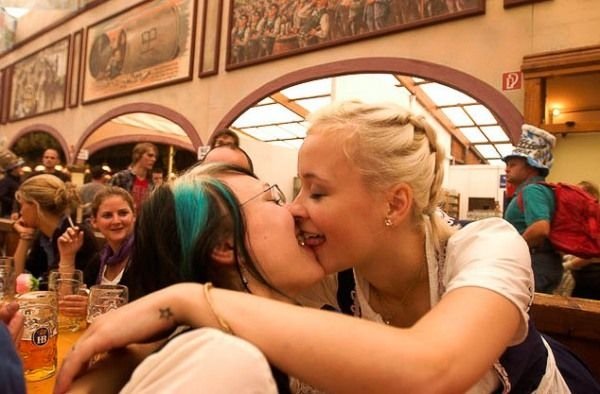 Oktoberfest girls kissing, Munich, Bavaria, Germany