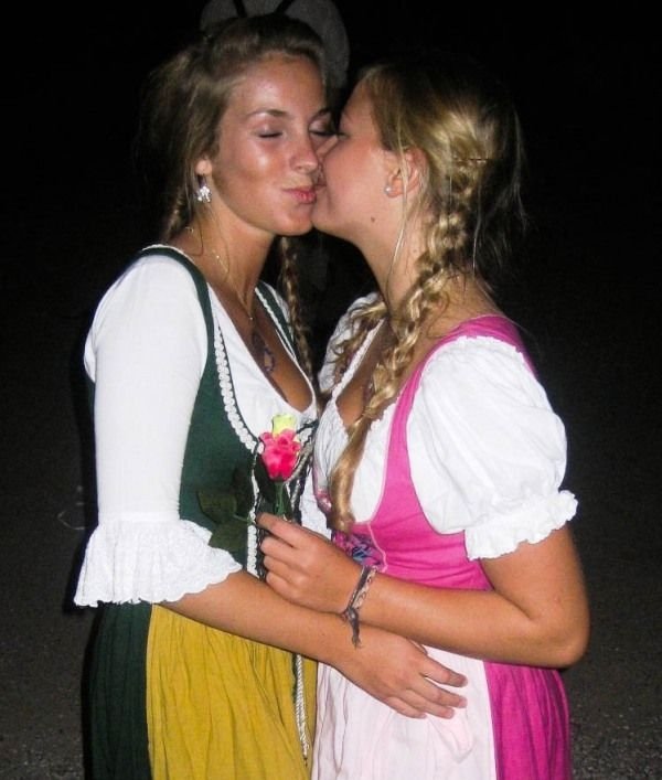 Oktoberfest girls kissing, Munich, Bavaria, Germany