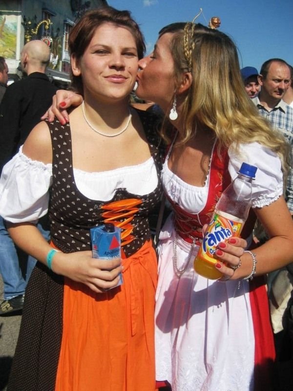 Oktoberfest girls kissing, Munich, Bavaria, Germany