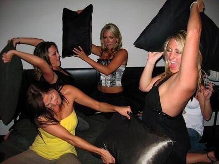 girls fighting with pillows