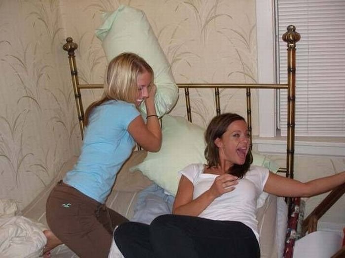 girls fighting with pillows