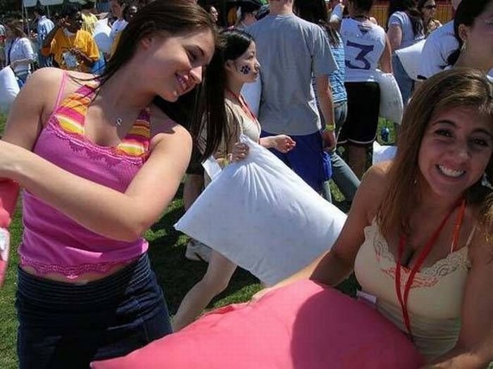 girls fighting with pillows