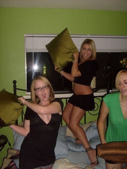 girls fighting with pillows