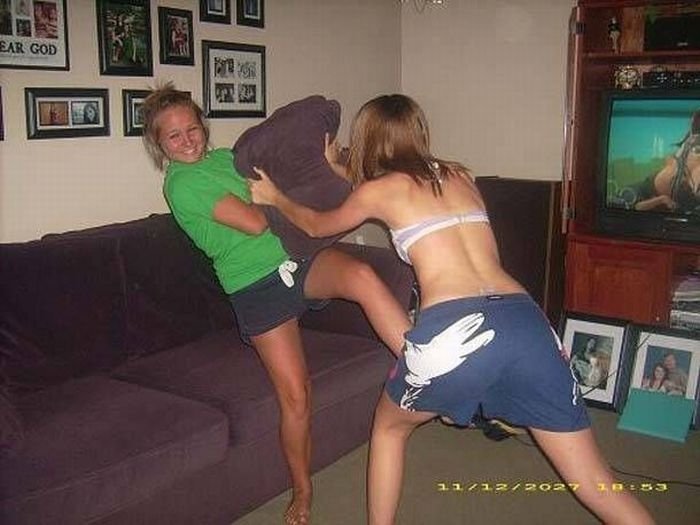 girls fighting with pillows