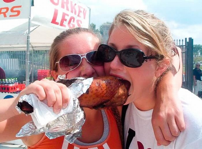 girls eating a turkey leg