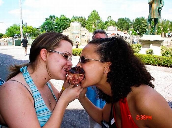 girls eating a turkey leg