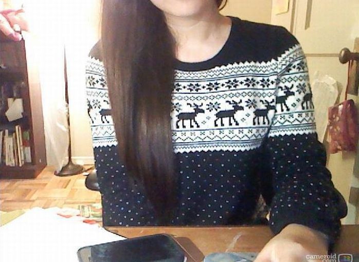 girl wearing a christmas sweater