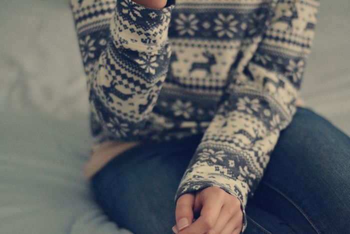 girl wearing a christmas sweater
