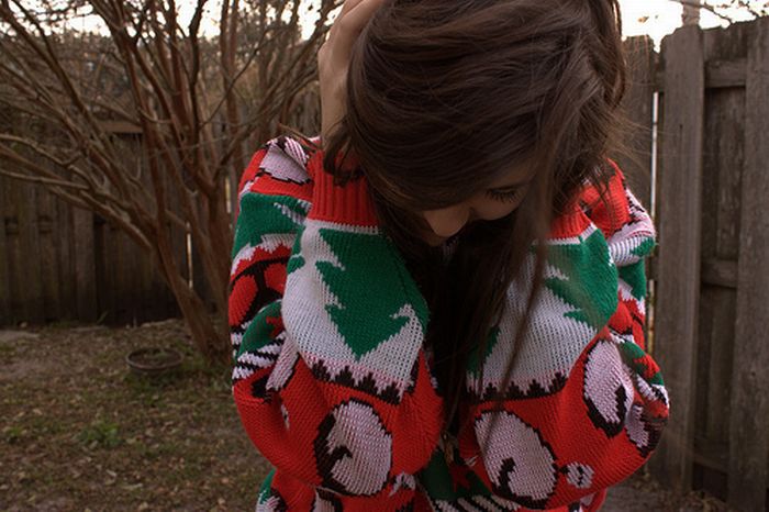 girl wearing a christmas sweater