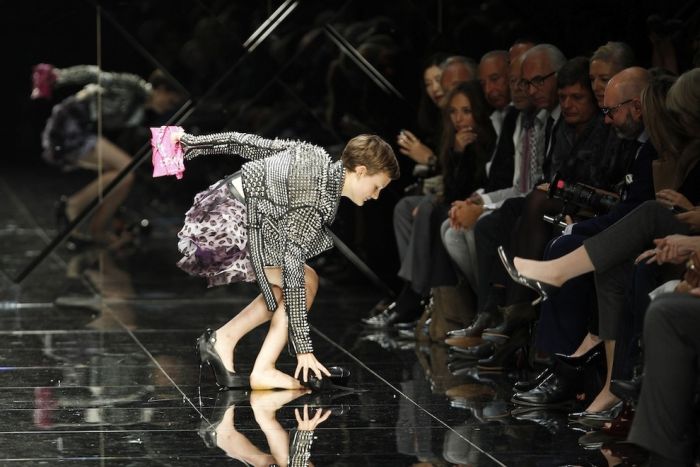 models falling on the catwalk