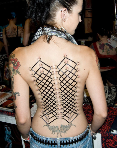 girl with a corset piercing and extreme body modifications