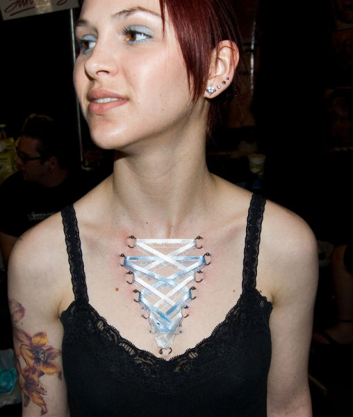 girl with a corset piercing and extreme body modifications