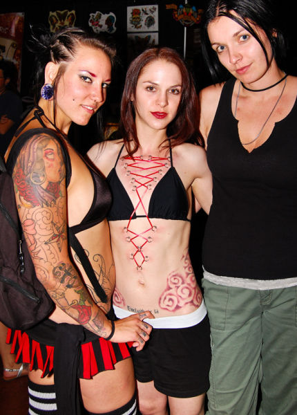 girl with a corset piercing and extreme body modifications