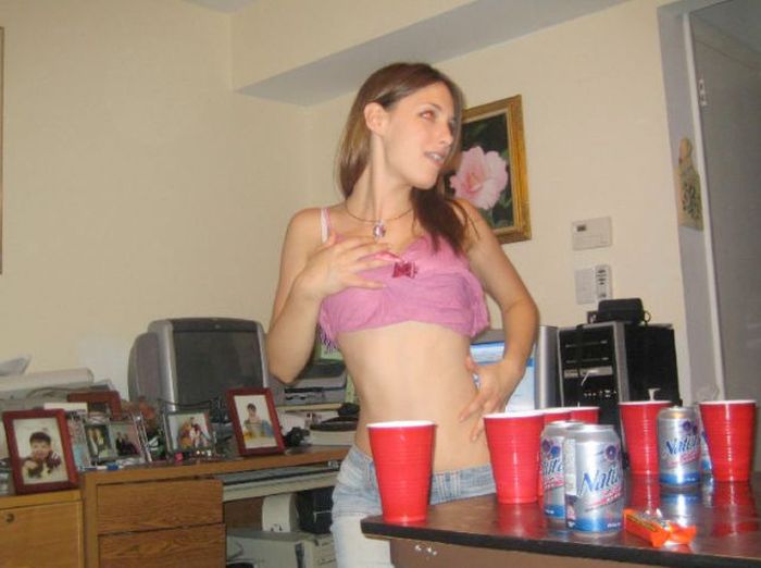 young girls playing beer pong