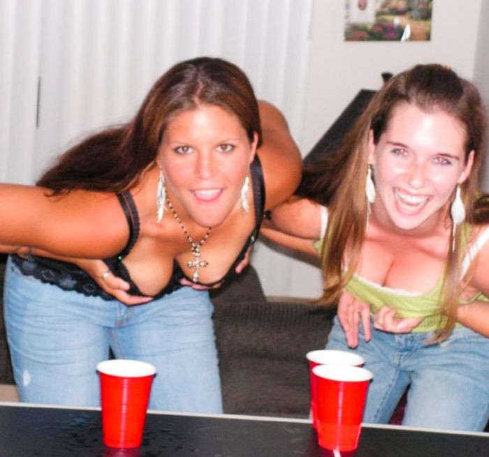 young girls playing beer pong