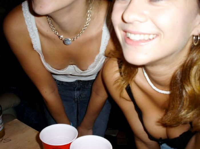 young girls playing beer pong