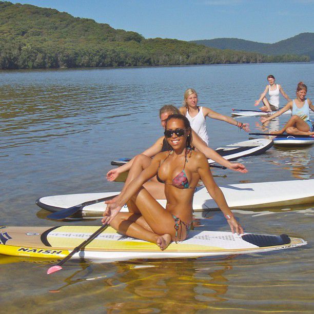 paddle board yoga surfing girl