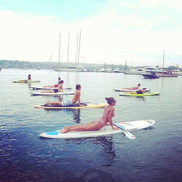 paddle board yoga surfing girl