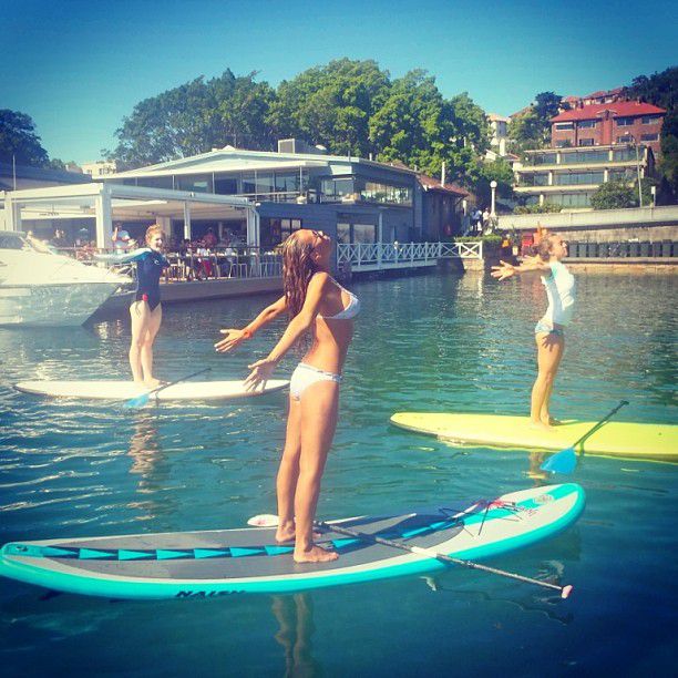 paddle board yoga surfing girl