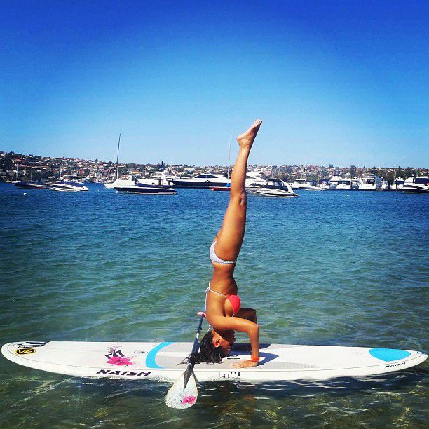 paddle board yoga surfing girl