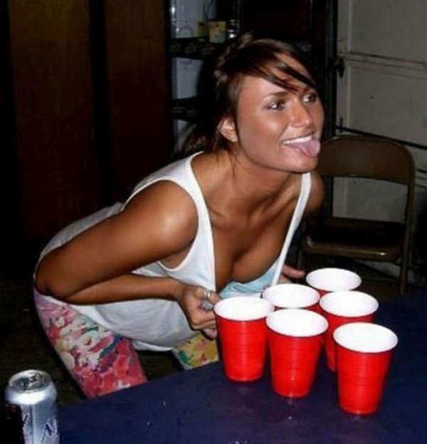 young girls playing beer pong