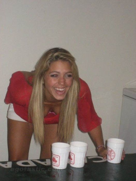 young girls playing beer pong