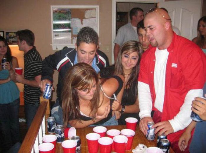 young girls playing beer pong