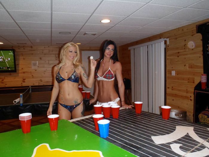 young girls playing beer pong