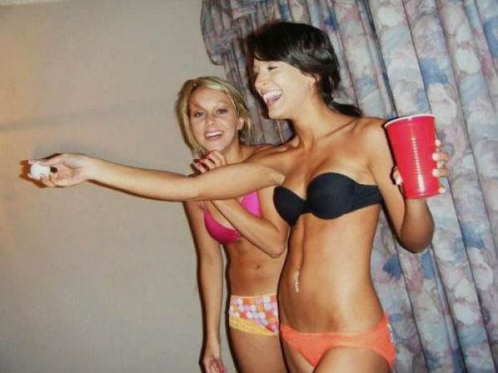 young girls playing beer pong