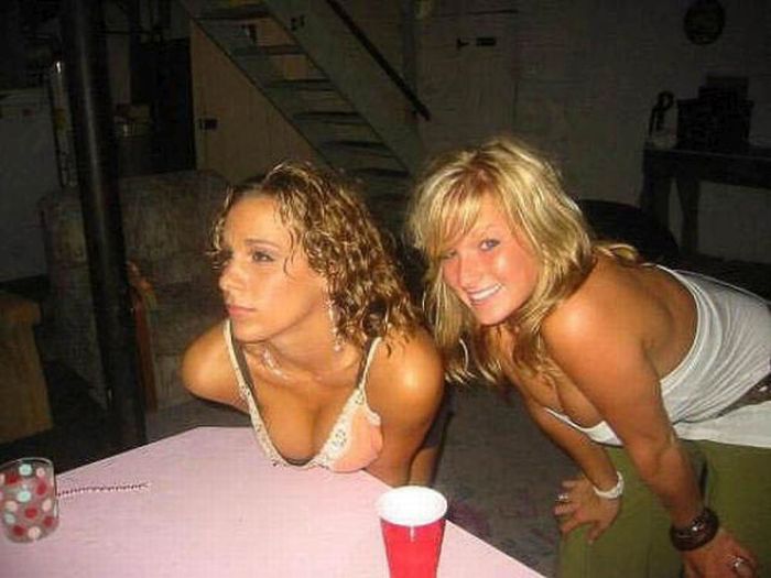 young girls playing beer pong