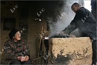 People & Humanity: Grandmother with unicorn, Zhang Ruifang, Henan Province, China