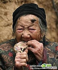 People & Humanity: Grandmother with unicorn, Zhang Ruifang, Henan Province, China