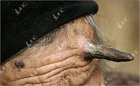 People & Humanity: Grandmother with unicorn, Zhang Ruifang, Henan Province, China