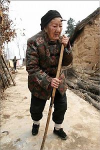 People & Humanity: Grandmother with unicorn, Zhang Ruifang, Henan Province, China