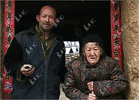 People & Humanity: Grandmother with unicorn, Zhang Ruifang, Henan Province, China