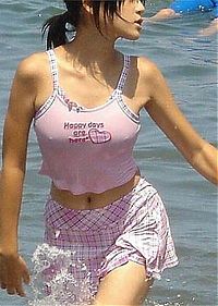 People & Humanity: asian girl wearing pink clothes in the sea
