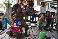 People & Humanity: 2-year-old boy smokes, Indonesia