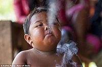 People & Humanity: 2-year-old boy smokes, Indonesia