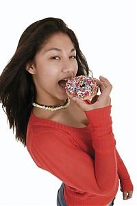 People & Humanity: girl eating doughnut