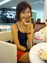 People & Humanity: girl eating doughnut