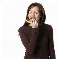 People & Humanity: girl eating doughnut