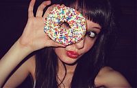 People & Humanity: girl eating doughnut