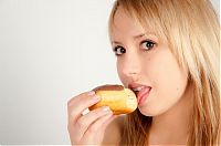 People & Humanity: girl eating doughnut