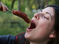 People & Humanity: girl eating hot dog