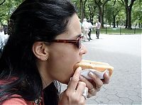 People & Humanity: girl eating hot dog