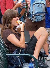 People & Humanity: girl eating hot dog