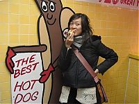 People & Humanity: girl eating hot dog