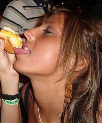 People & Humanity: girl eating hot dog